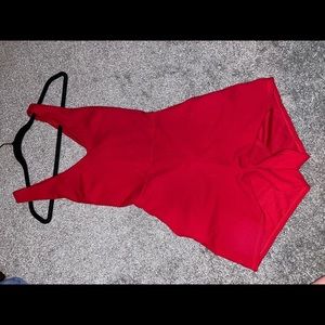 Red romper, size S, could definitely fit a medium also.